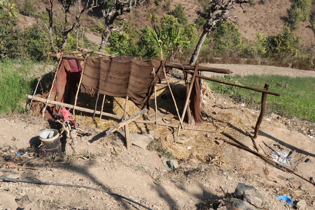 A shed built using clothes and local materials.