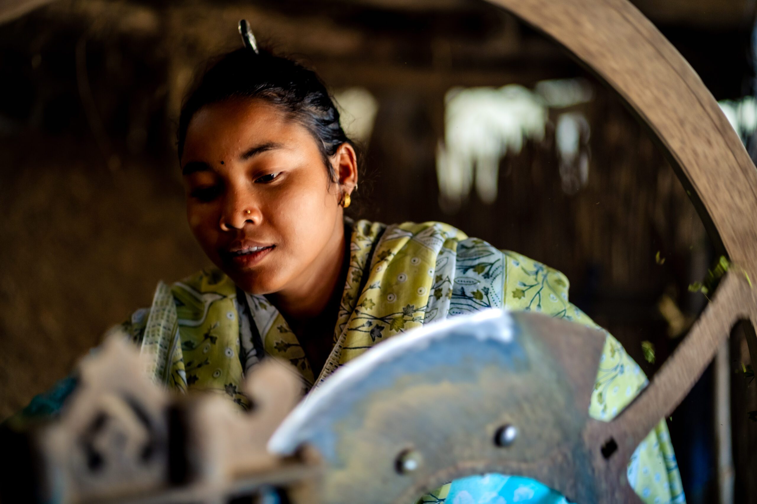 A young girl Ajani preparing food for her goats.