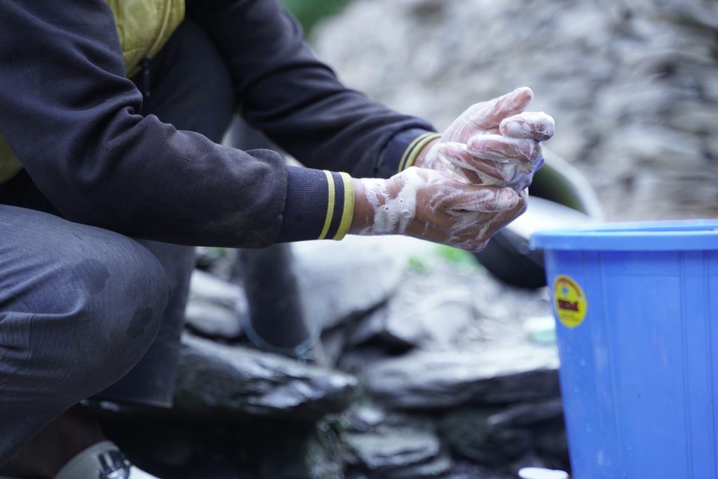 A man washing his hands.