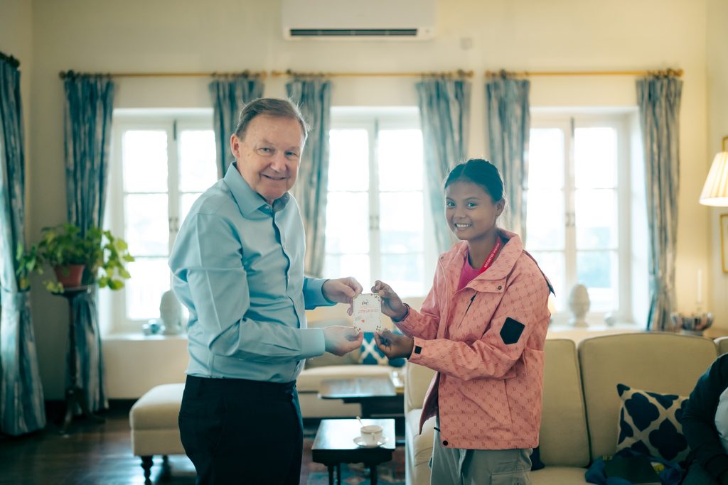 Sima (on right) presenting a zine she made to H.E. Rob Fenn, ambassador of British Embassy during GirlsTakeover.