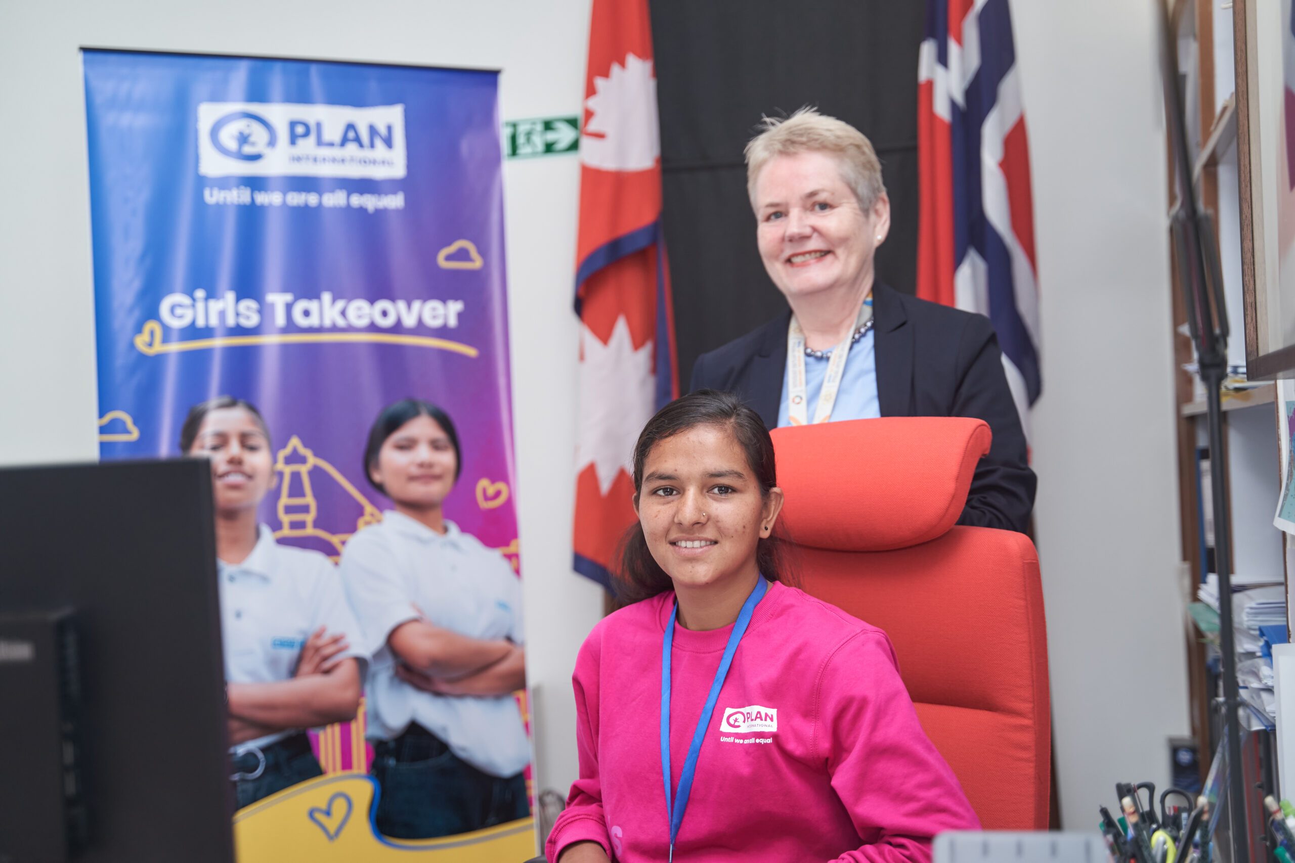 Lalita, sitting in a chair and H.E. Torun Torun Dramdal, Ambassador at the Embassy of Norway standing during GirlsTakeover event.