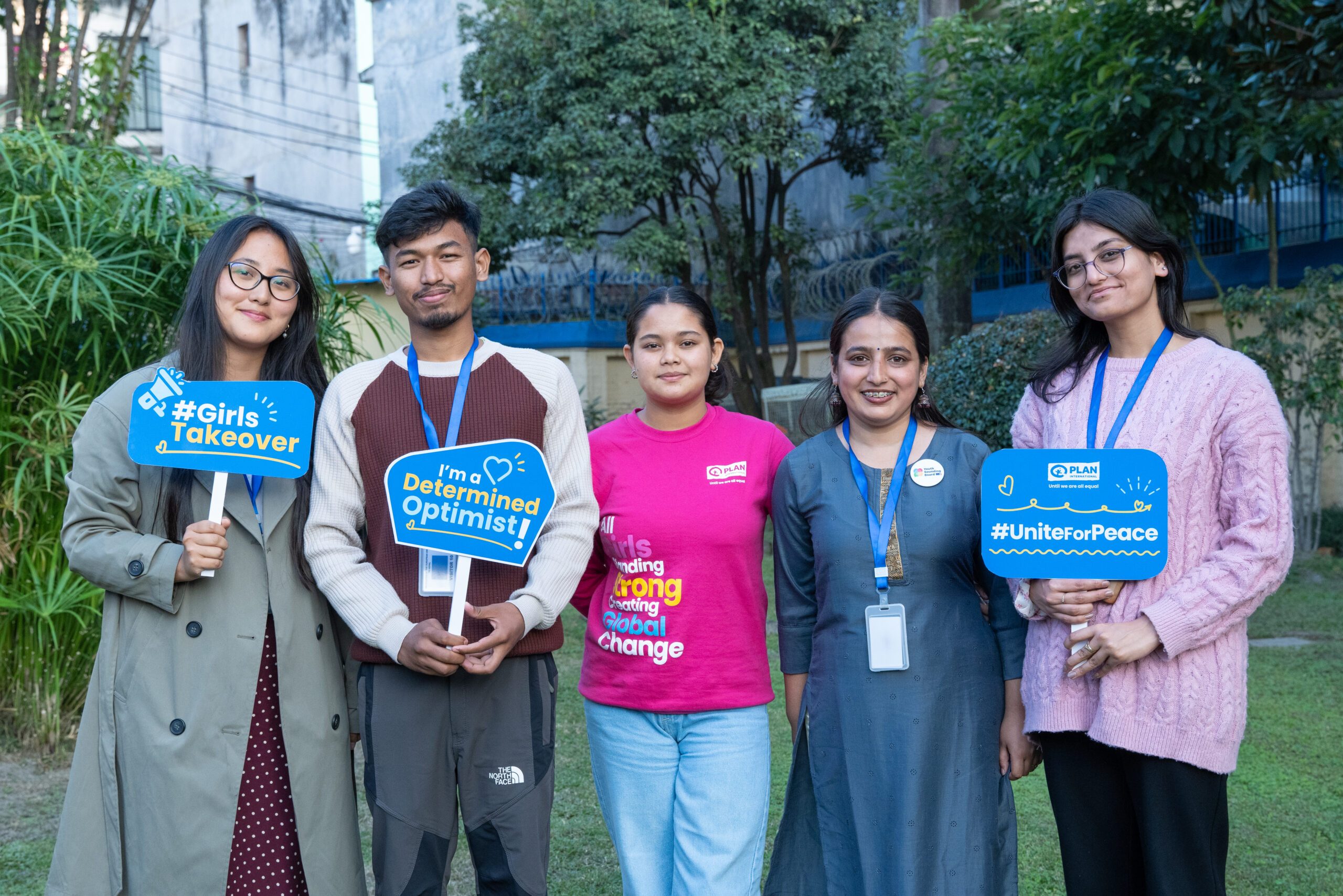 Ranjita with young people holding the placards.