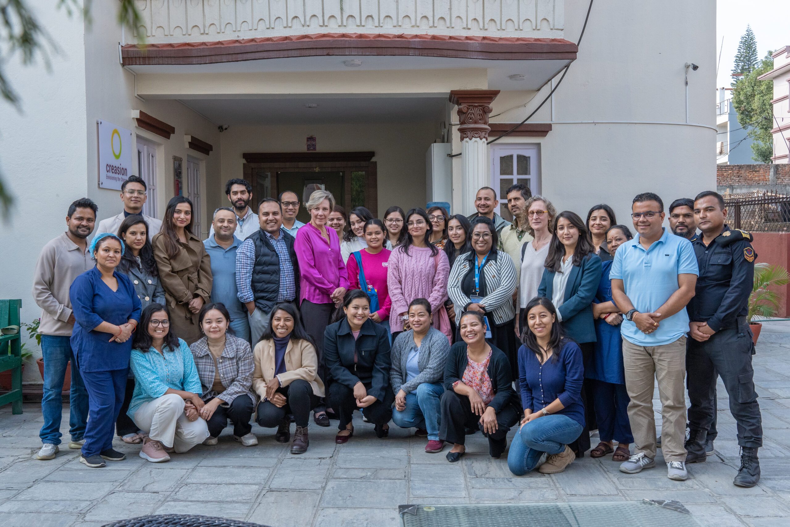 Ranjita is posing for group photo with Creasion Nepal and EU team.