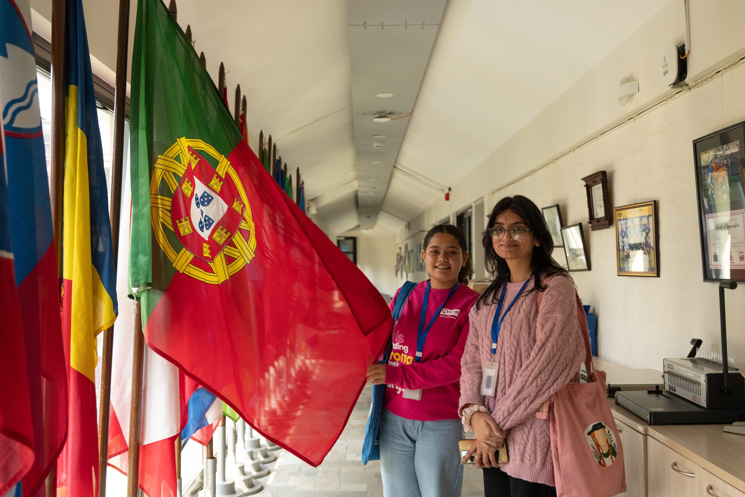 Ranjita with another girl holding flag of Spain.