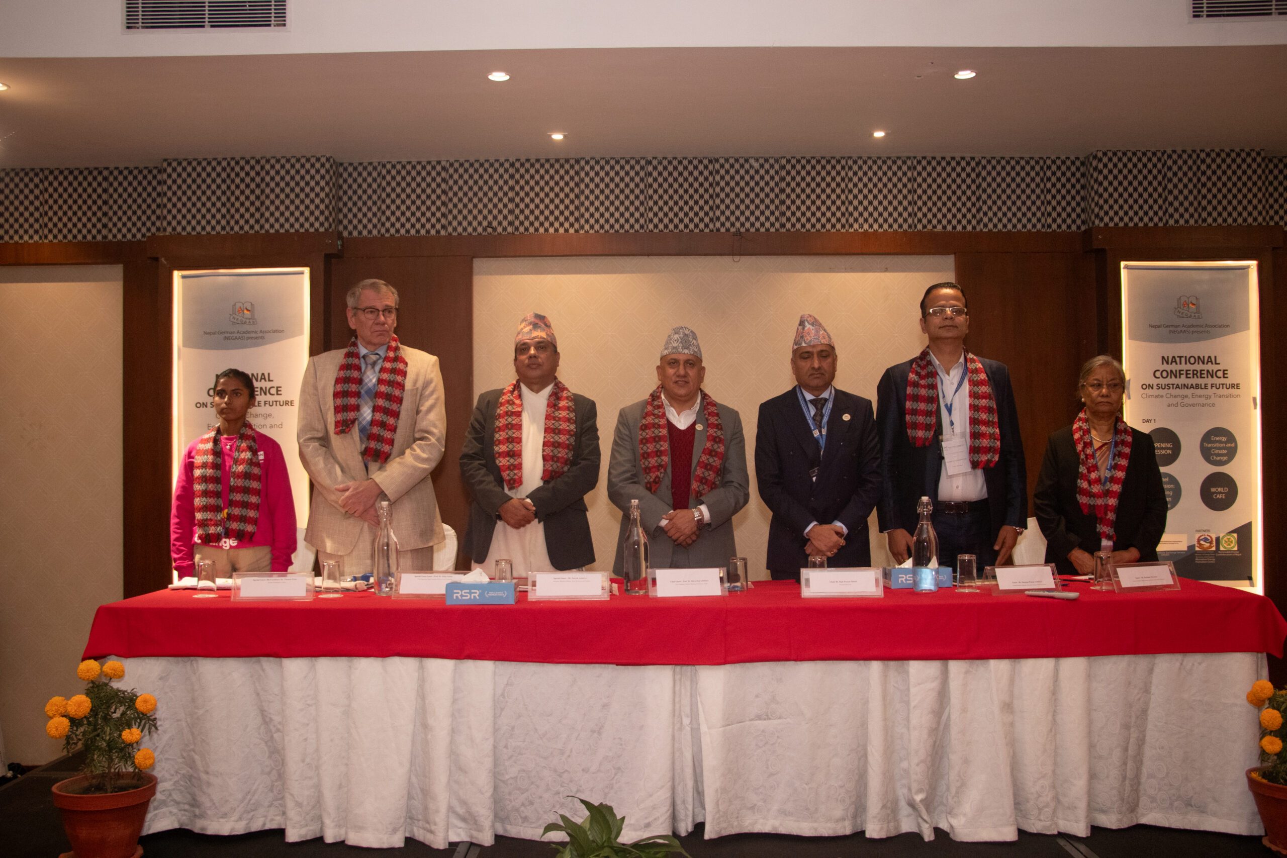 Anita on left with ambassador and other government stakeholders in an event. 