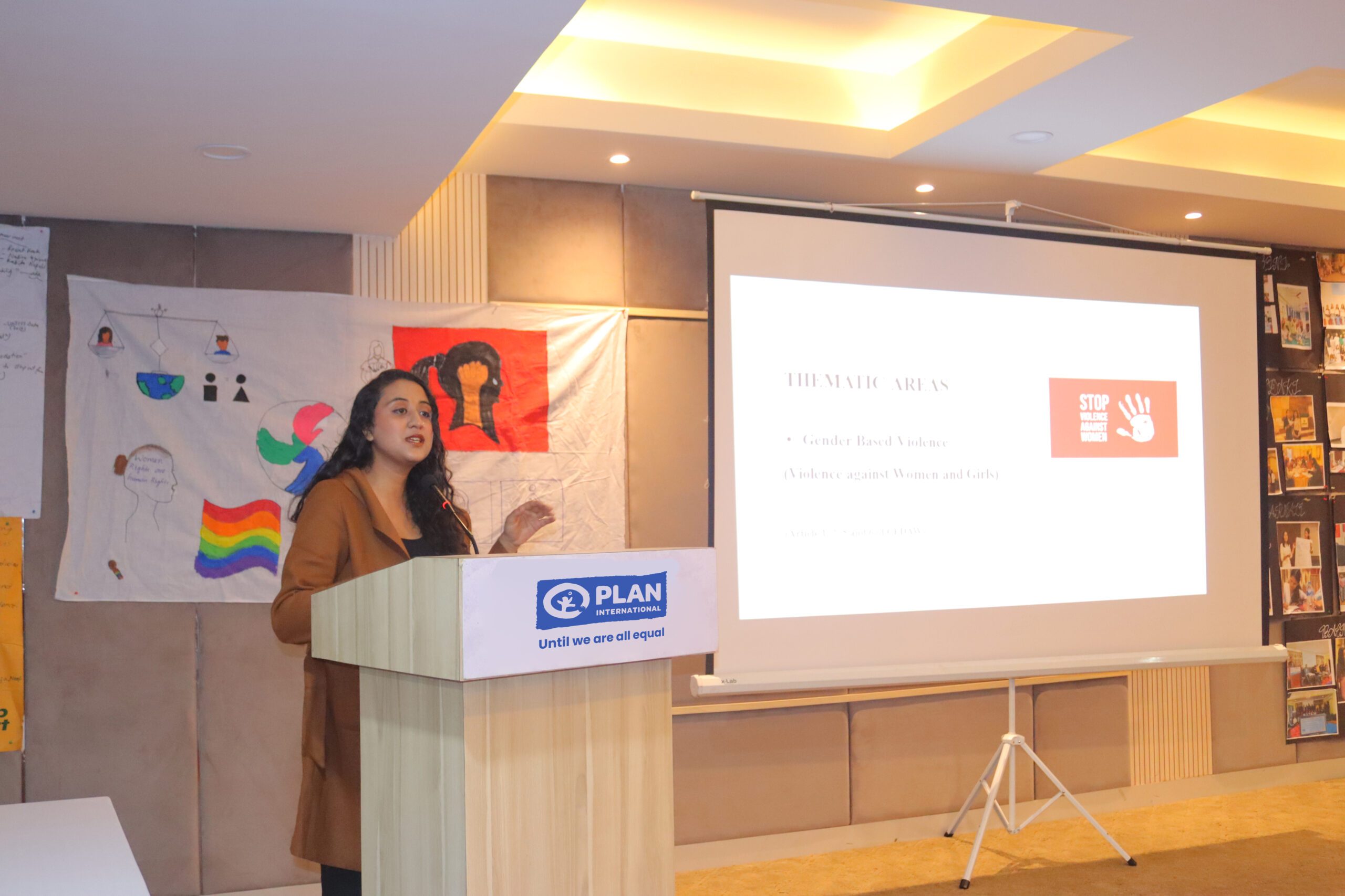 A young woman speaking in an event