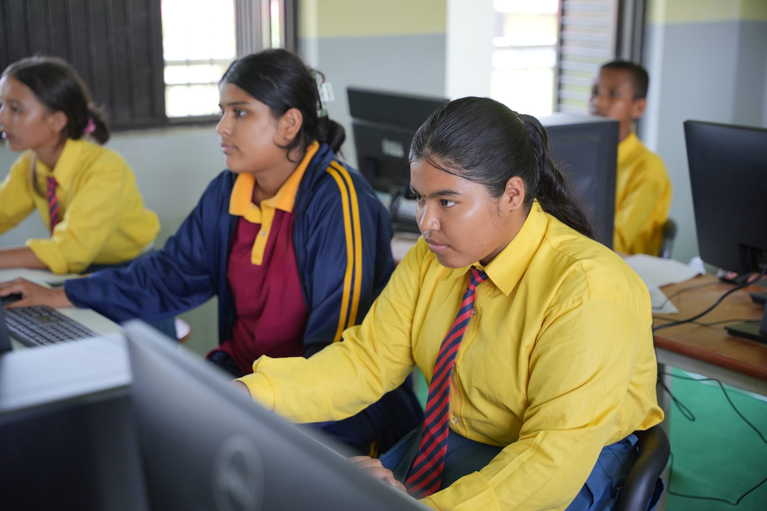 Students learning computers in their school. 