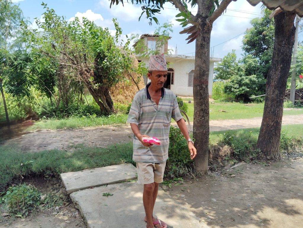 Gyan Bahadur in his passage to home carrying sanitary pads.