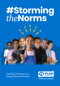 A group of young girls standing strong. A girl in the middle holding scissors.