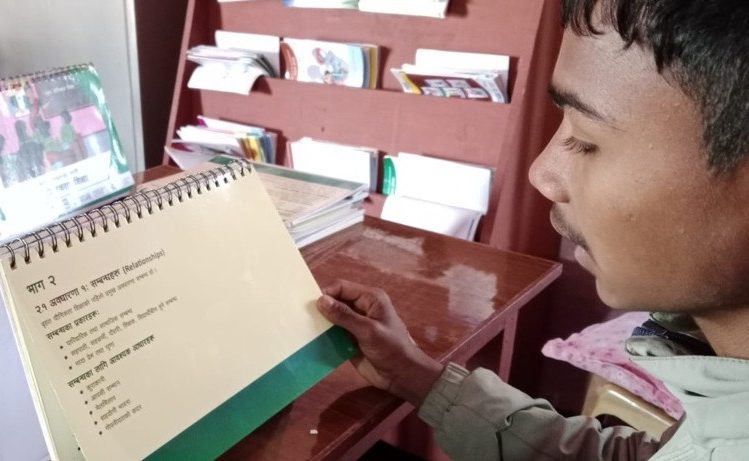 Rohit is looking into a flipchart