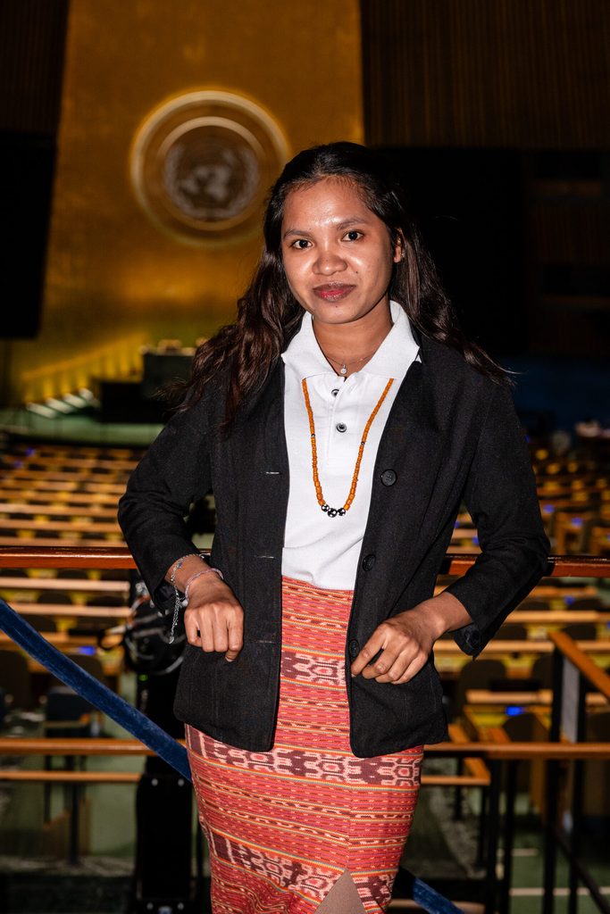 With a radiant smile lighting up her face, Lilerita stands tall and proud, dressed in the vibrant traditional attire of Timor-Leste. Inside the grand halls of the United Nations Headquarters, she carries the spirit and culture of her homeland with grace and confidence, a living symbol of her country's pride on the world stage.