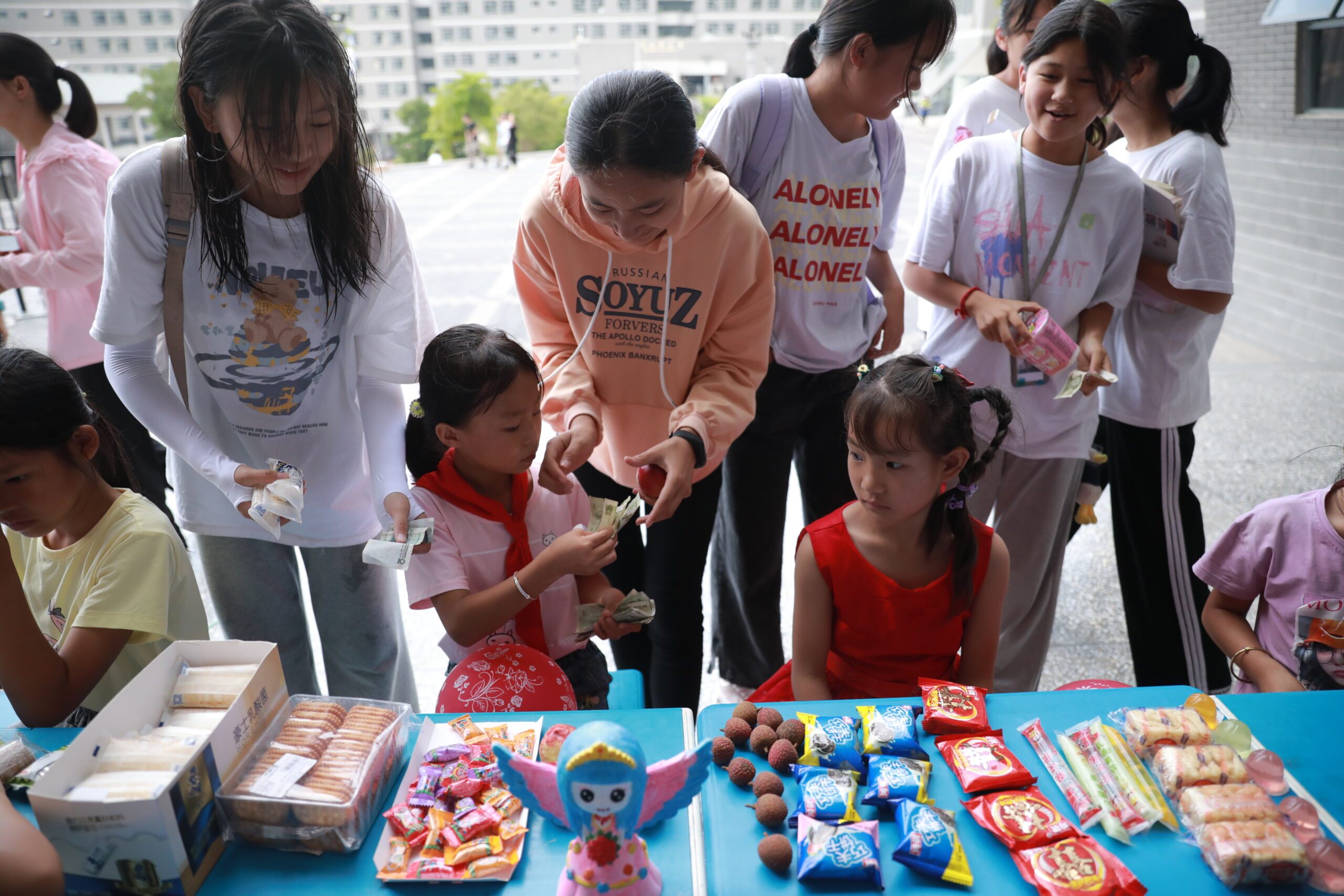 Children selling their products to others at school