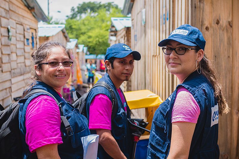 Colaboradores de Plan International Guatemala trabajando en comunidades vulnerables.