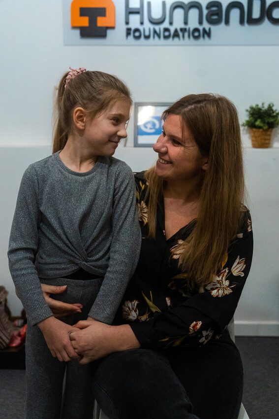 Halyna and Zlata smiling at each other. 