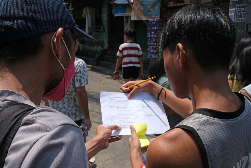 Young people outside on the city streets assessing risks. 