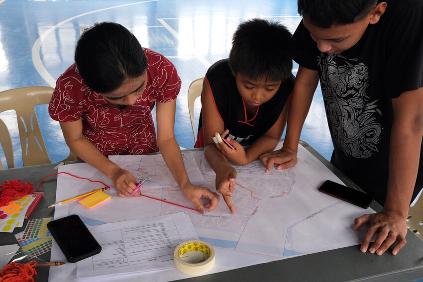 Young people working on risk map of the city. 